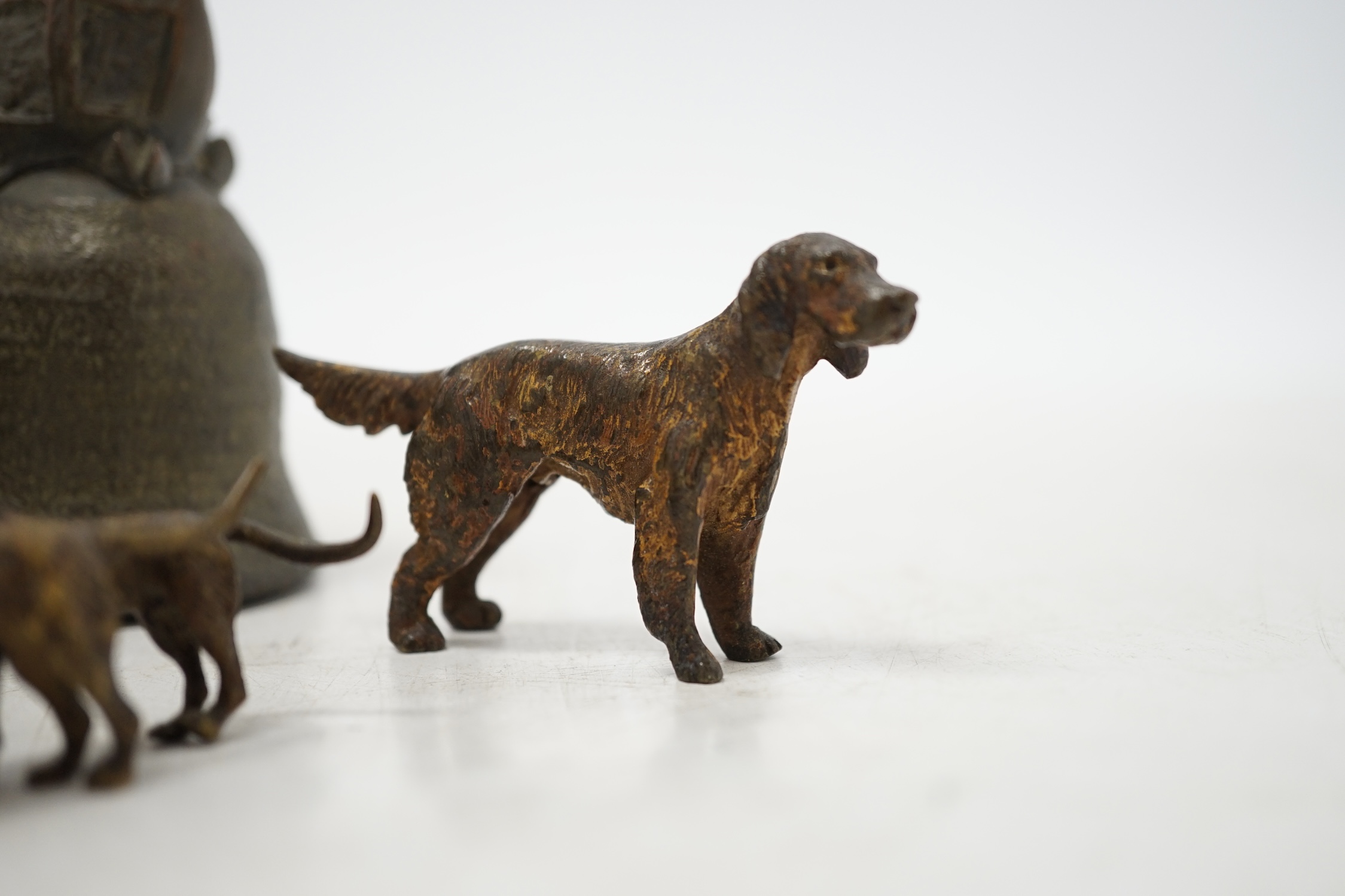 Three cold painted bronze dogs and a bronze giraffe handled bell, bell 13.5cm high. Condition - fair
